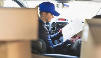 woman-with-packed-box-car